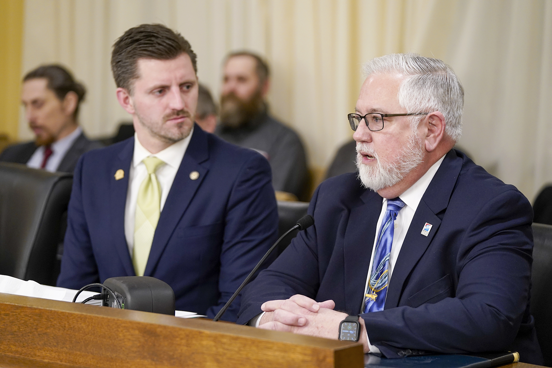 Brent Christensen, president/CEO of the Minnesota Telecom Alliance, testifies Feb. 20 before the House Workforce, Labor, and Economic Development Finance and Policy Committee in favor of HF47. Rep. Isaac Schultz, left, is the bill sponsor. (Photo by Michele Jokinen)